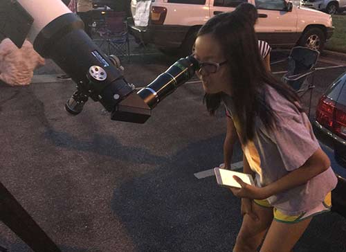 looking through a telescope