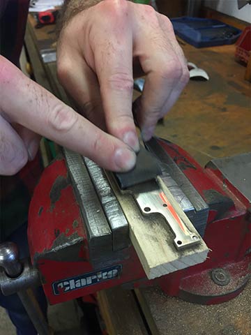 We use a range of grit paper to achieve the finish, usually ranging from 240 all the way up to 10,000