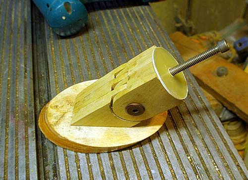 mounting plate for the secondary mirror is glued and screwed into place