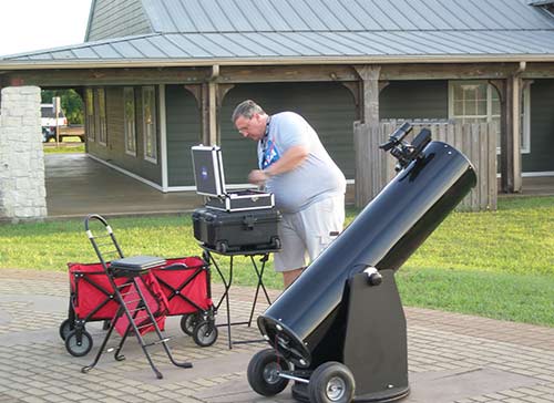 Campbell setting up equipment at McNair outreach