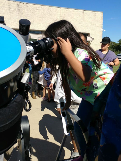 Young observer taking a close look at the eclipse
