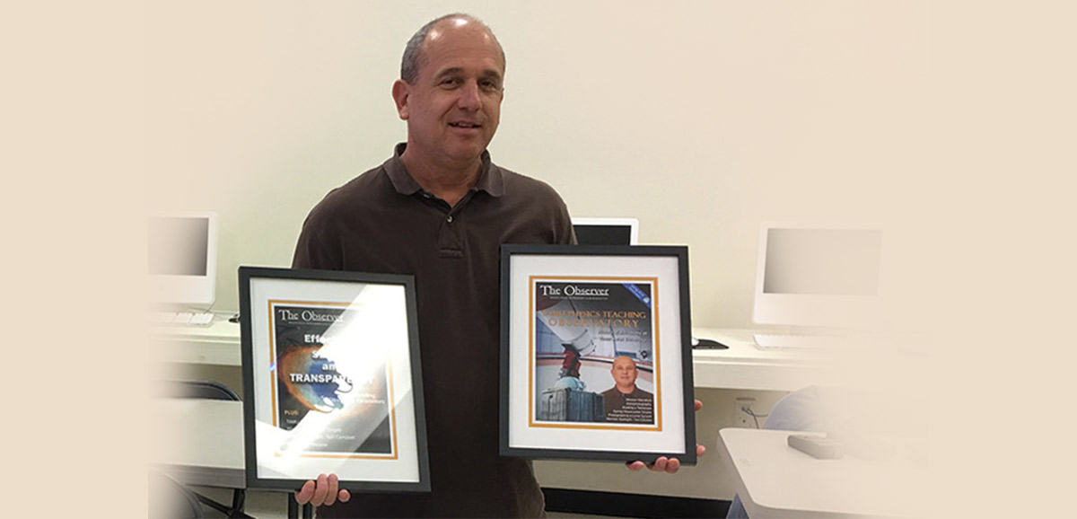 Don holds covers of two newsletters that contain his articles