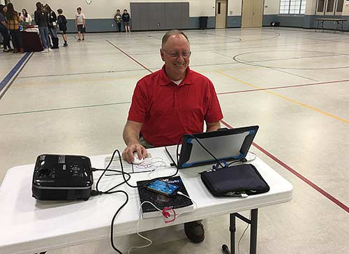 Jim Lamar sets up slideshow