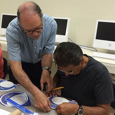 Spearman sharing knowledge with science teacher