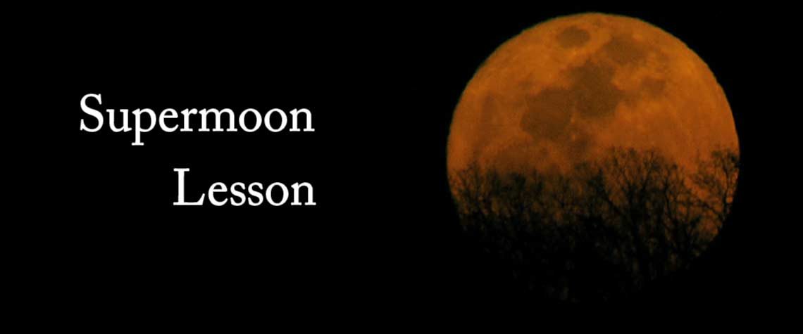 Supermoon rising on horizon